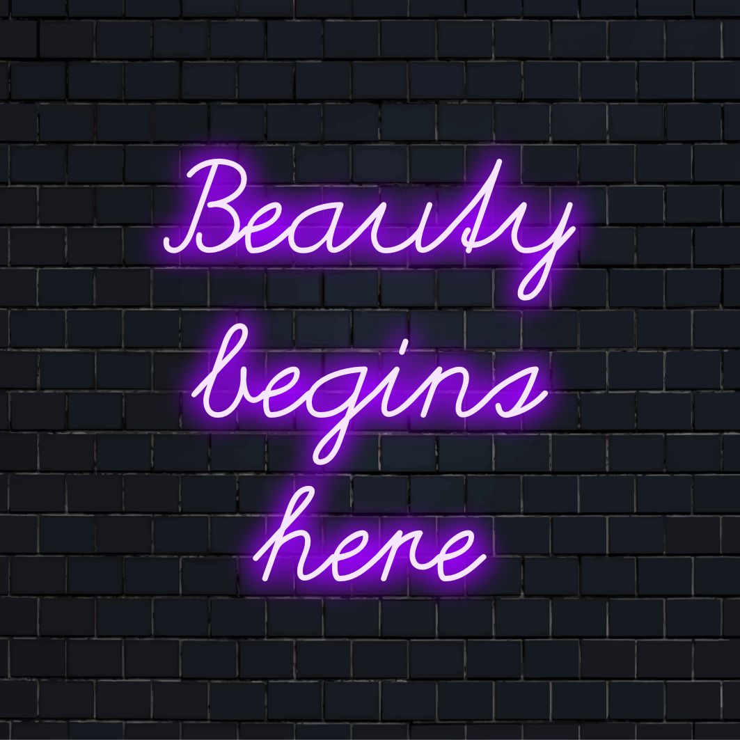 Vielseitiges LED-Neonschild mit der Aufschrift „Beauty Begins Here“, das Neon-Zitatkunst mit benutzerdefinierten LED-Designelementen kombiniert.