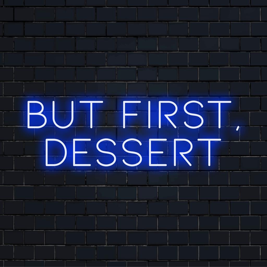 LED-Neonschild mit der Aufschrift „But First, Dessert“ in leuchtendem Pink, eine verspielte Botschaft, perfekt für Naschkatzen-Umgebungen.