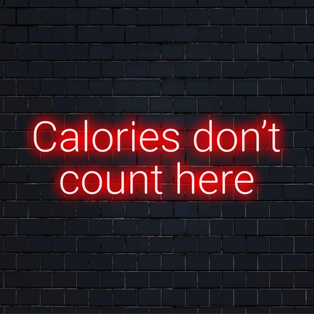 Individuelles LED-Neonschild mit der Aufschrift „Calories Don't Count Here“, ideal, um jedem Raum eine lustige, persönliche Note zu verleihen.