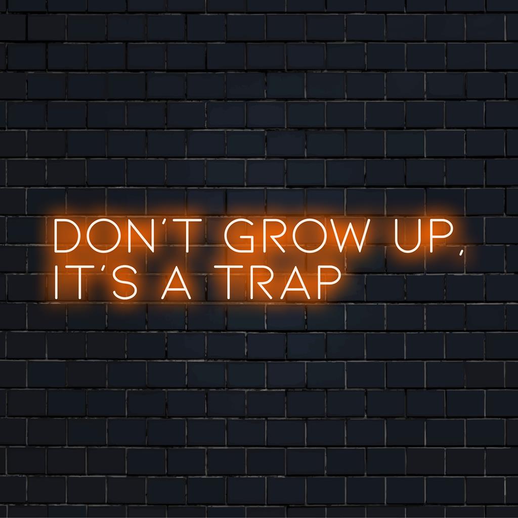 Maßgefertigtes LED-Neonschild mit der Aufschrift „Don't Grow Up It's A Trap“ – eine auffällige Neonbotschaft für jeden Raum.