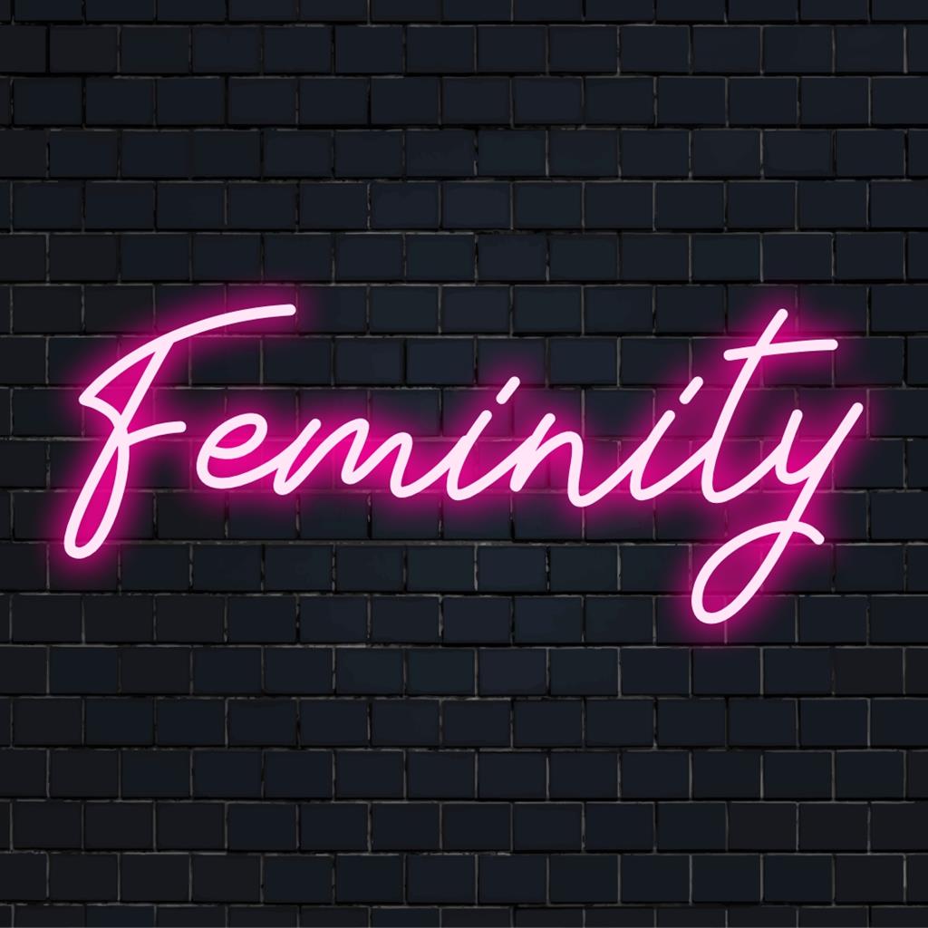 Individuelles LED-Neonschild mit dem Titel „Feminity“ mit eleganten Kurven und leuchtenden Rosatönen, ideal für ein schickes Dekorambiente.