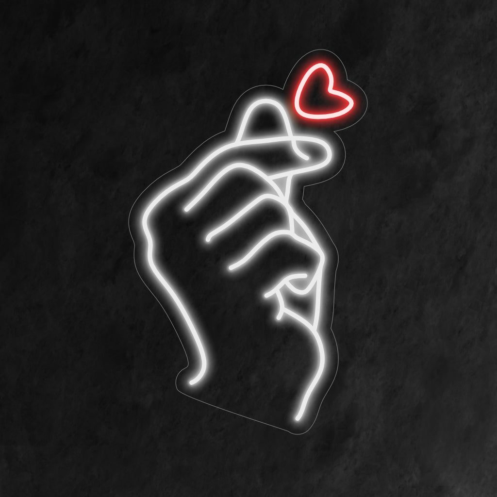 „Finger Heart Neon Sign“ leuchtet mit Liebe, perfekt für Räume, die Positivität und die herzerwärmende Geste des Fingerherzens ausstrahlen und der Atmosphäre eine süße Note verleihen.