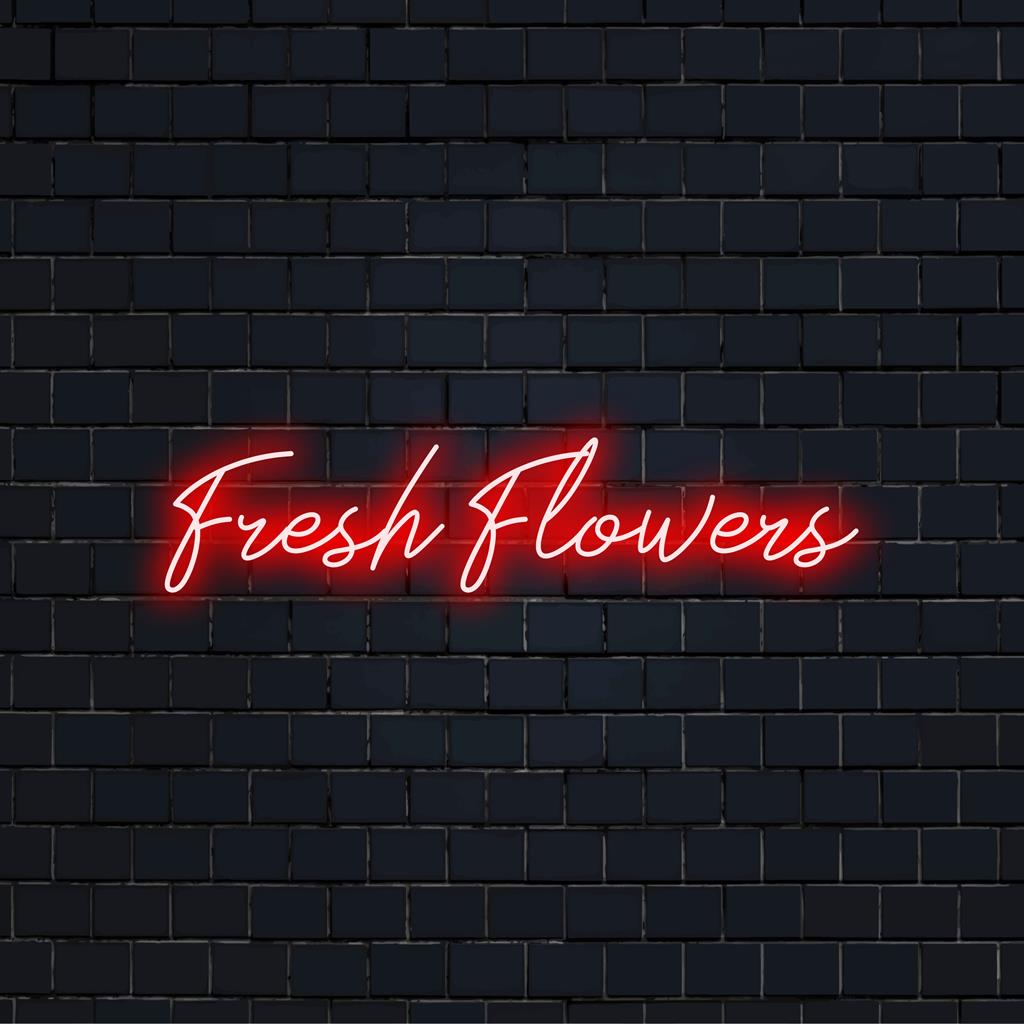 Beleuchtetes Neonschild „Fresh Flowers“ mit hellem, individuellem LED-Schriftzug, perfekt für eine lebendige Neon-Inneneinrichtung.