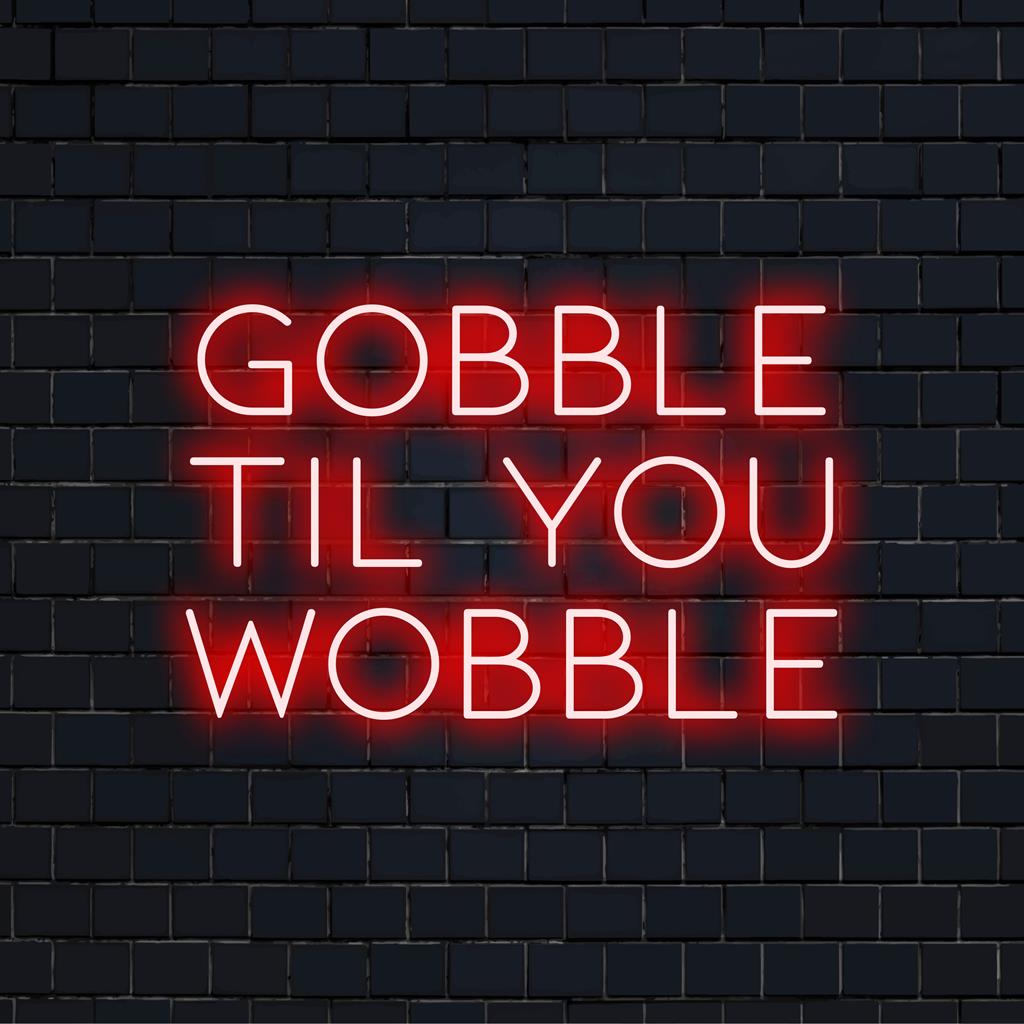 Individuelles LED-Neonschild mit dem skurrilen Spruch „Gobble Til You Wobble“, perfekt für festliche Neondekoration.