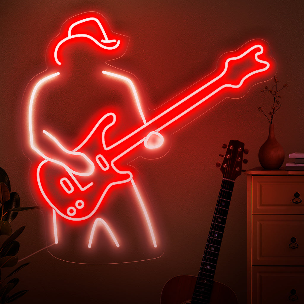 Das Neonschild „A Man Plays The Guitar“ fängt die Essenz musikalischer Leidenschaft mit einer Silhouette ein, die eine Gitarre klimpert. Werten Sie Ihren Raum mit dem rhythmischen Leuchten dieses stilvollen und fesselnden Neonlichts auf.