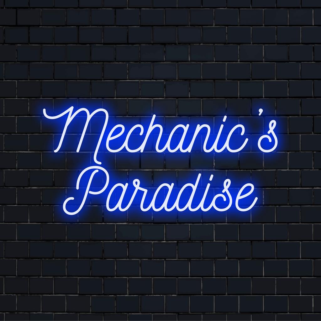 Individuelles Neonschild mit der Aufschrift „Mechanic‘s Paradise“ in leuchtenden LEDs, perfekt für eine personalisierte Neondekoration in einer Werkstattumgebung.