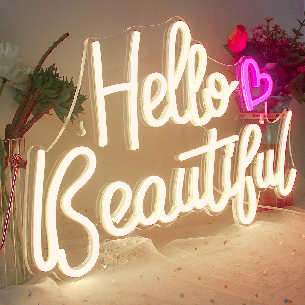Das Bild zeigt ein lebendiges, auffälliges LED-Neonschild mit der Aufschrift „Hello Beautiful“.