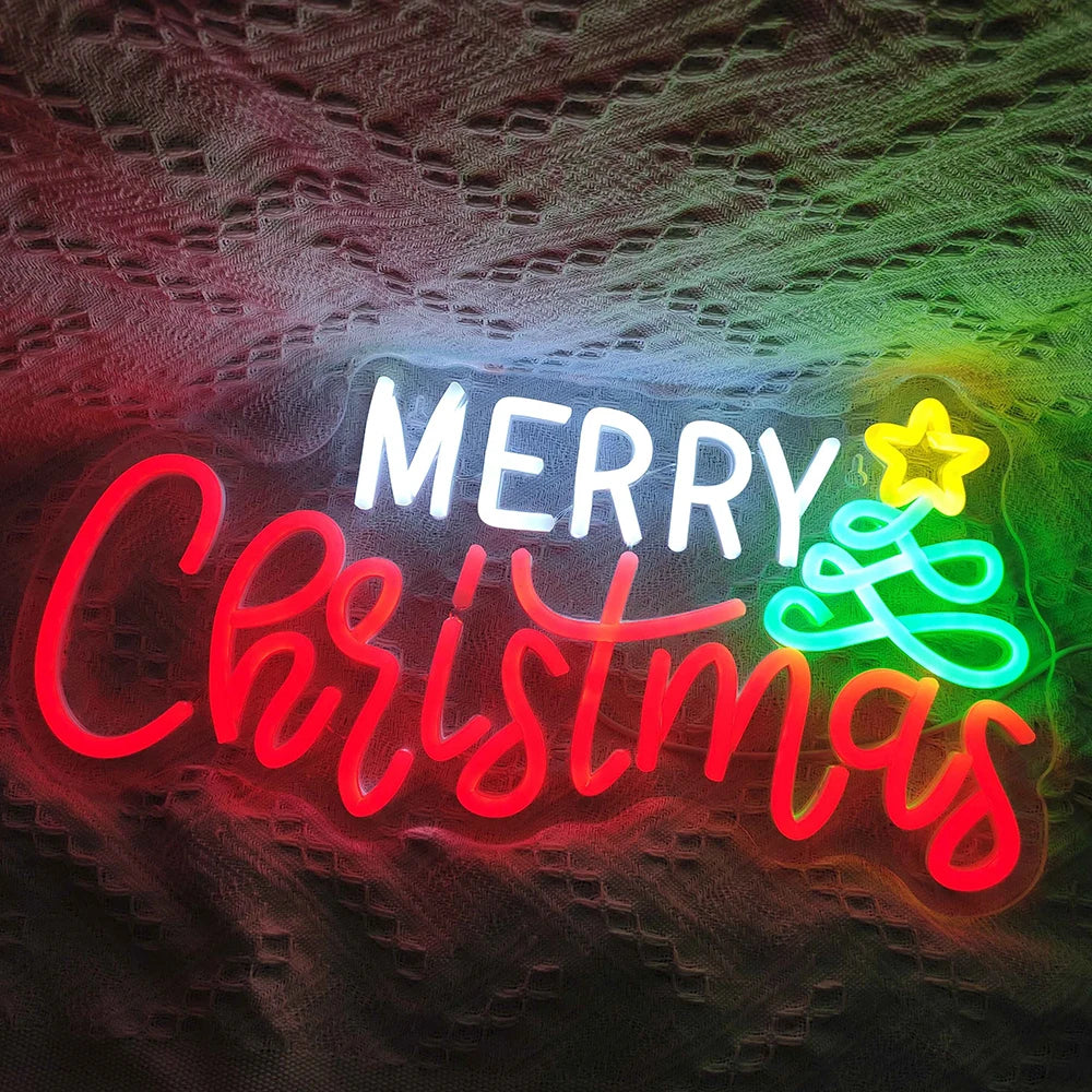 Das Bild zeigt ein lebendiges, handgefertigtes LED-Neonschild, auf dem in eleganter, fließender Schrift „Frohe Weihnachten“ steht.