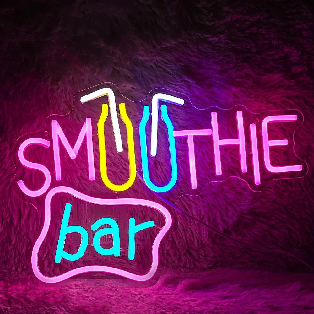 Das Bild zeigt ein leuchtendes LED-Neonschild mit der Aufschrift „Smoothie Bar“ in einer verspielten Schreibschrift.