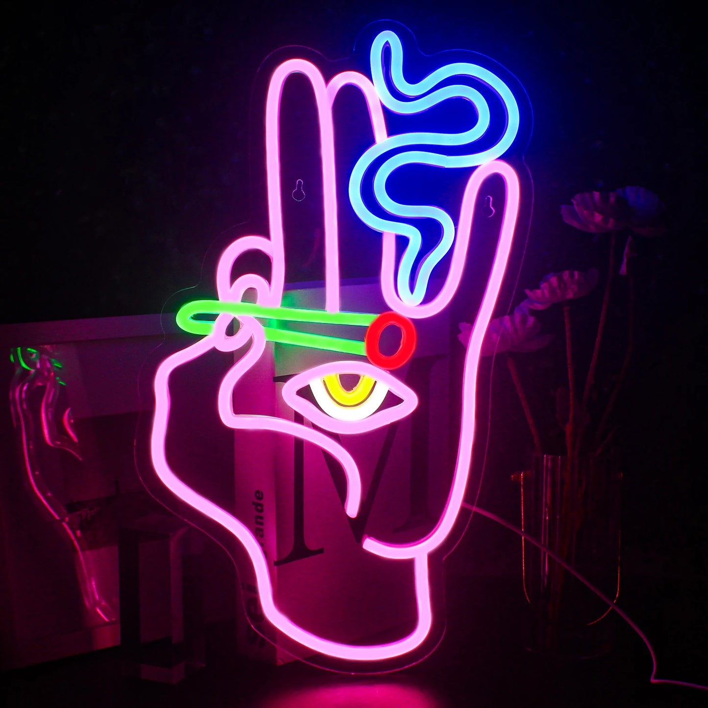 Das Bild zeigt ein LED-Neonschild in Form einer kunstvollen Hand, die eine Zigarette hält und aus der Rauch aufsteigt.