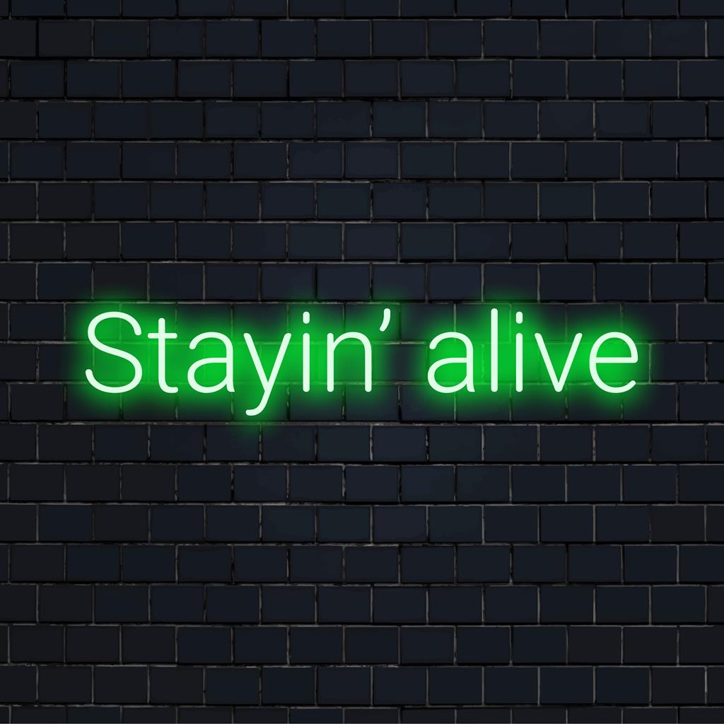 Maßgefertigtes LED-Neonschild mit dem kultigen Satz „Stayin‘ Alive“, perfekt für eine lebendige Neondekoration zu Hause oder im Büro.