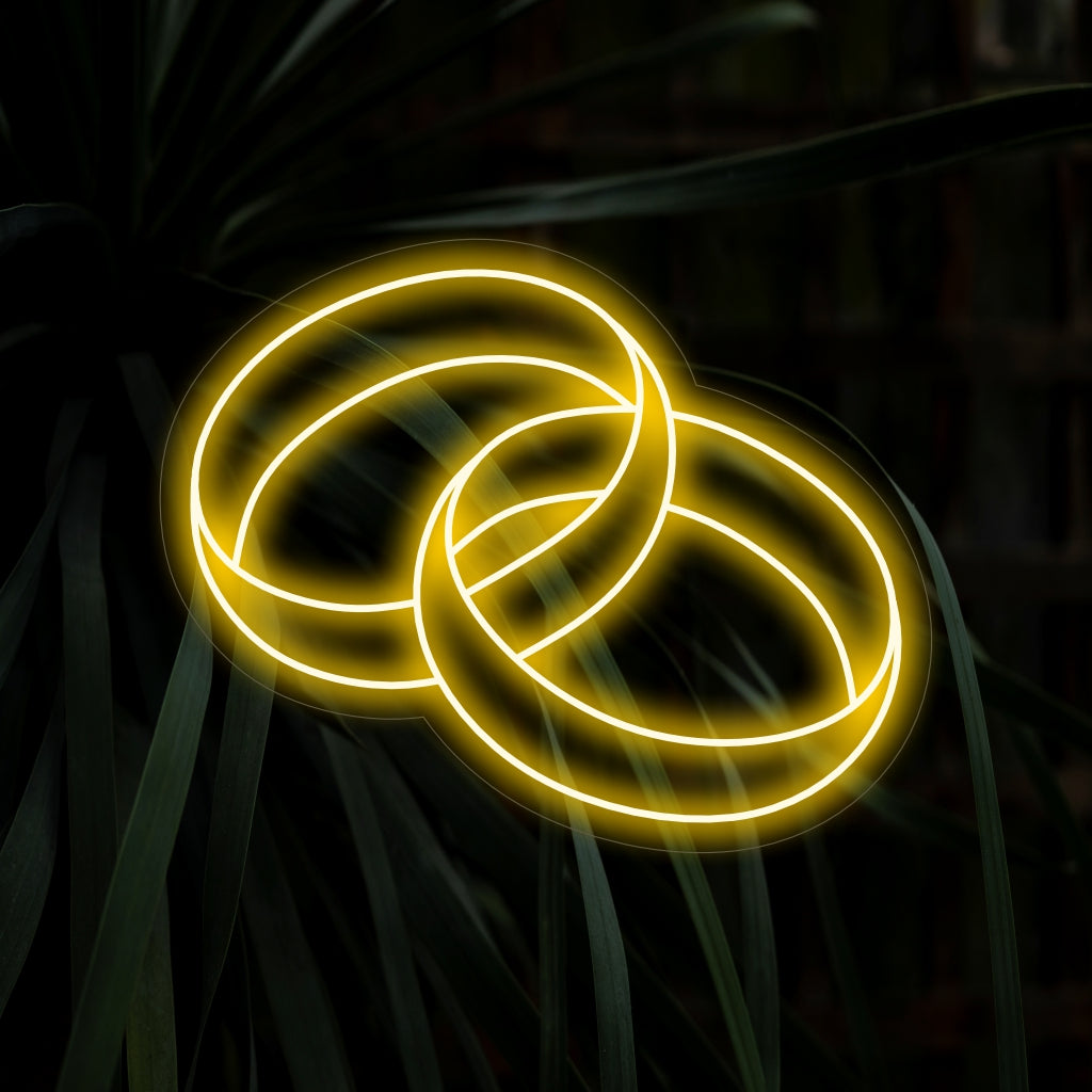 „Wedding Ring Neon Sign“ verleiht mit seinem eleganten Design einen Hauch von Romantik und verbreitet ein sanftes und bezauberndes Leuchten, das Liebe und Verbundenheit feiert.