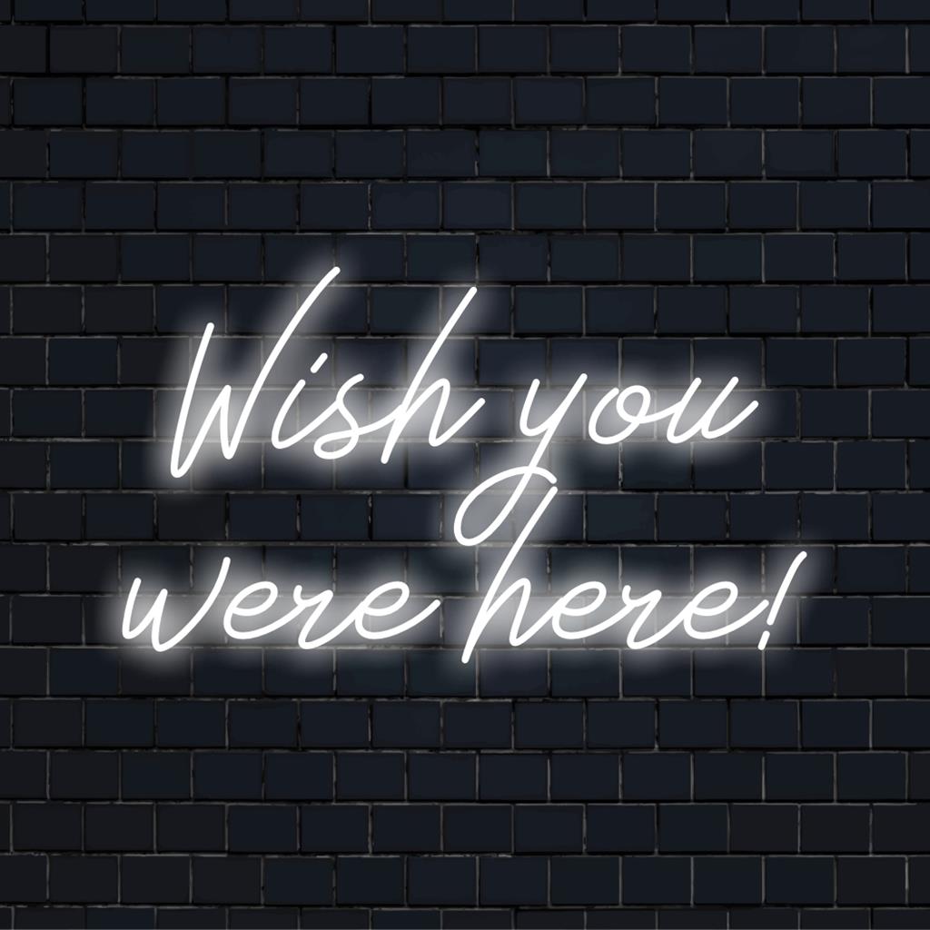 Das LED-Neonschild leuchtet „Wish You Were Here!“ in leuchtendem Pink, perfekte personalisierte Neonkunst zur Dekoration jedes Raums.