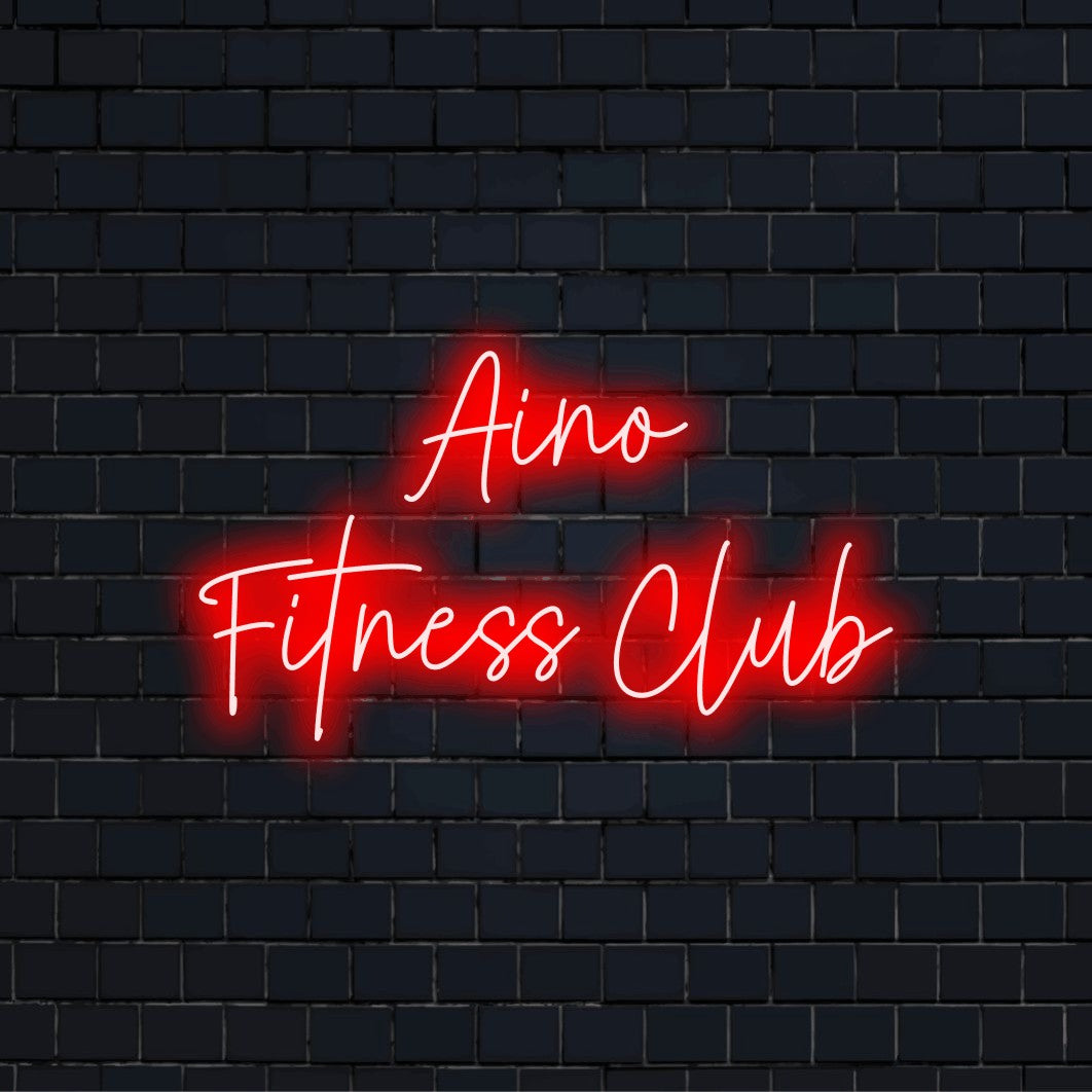 Aino Fitness Club Custom Name Neon Sign, bright neon lettering against brick backdrop