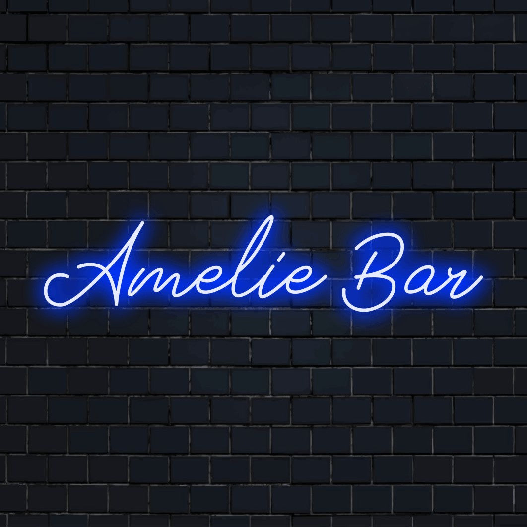 Amelie Bar Personalized LED Neon Sign, glowing lettering against black brick wall