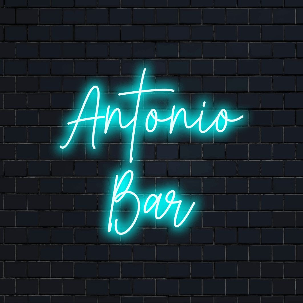 Antonio Bar Personalized LED Neon Sign, glowing lettering against brick backdrop