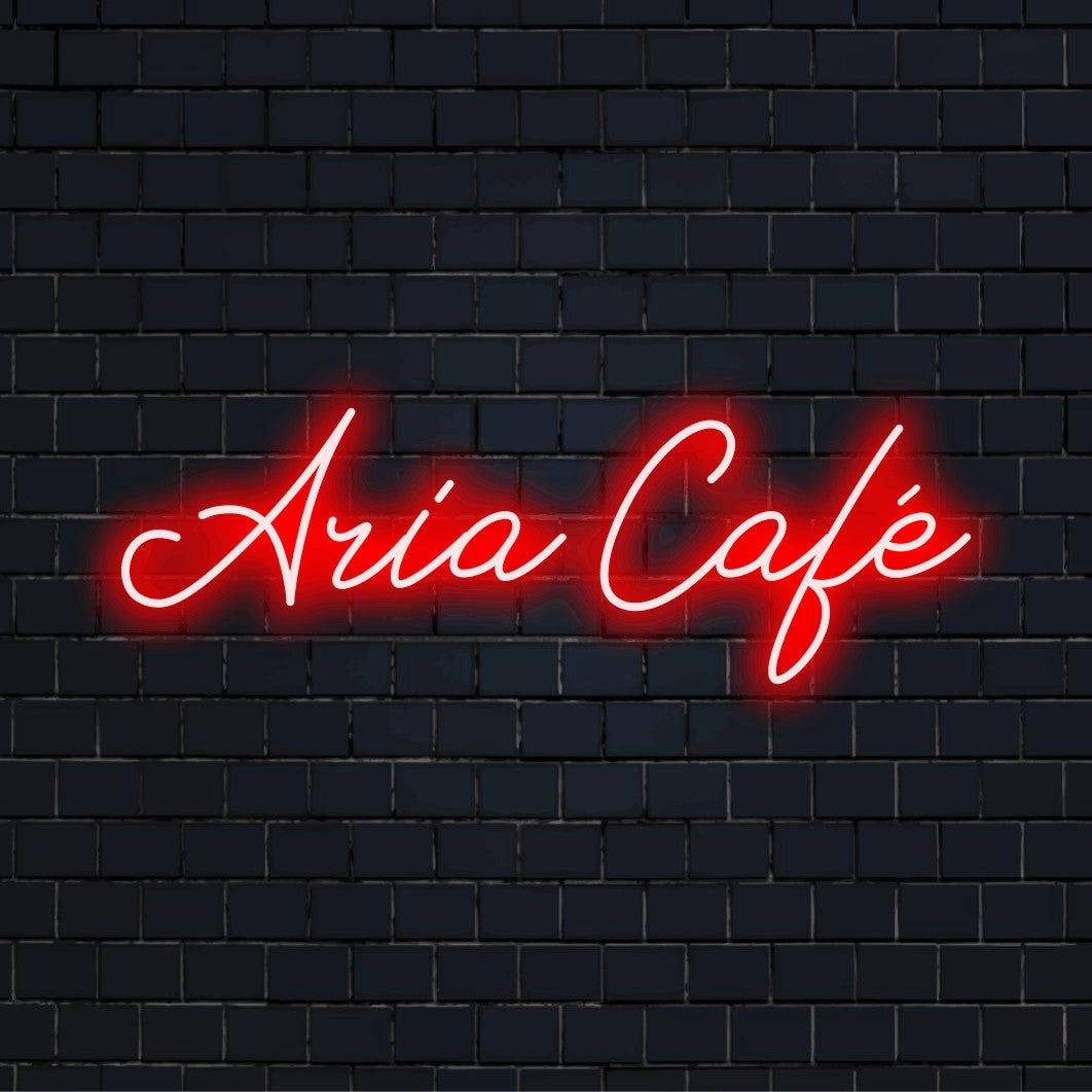 Aria Cafe Personalized LED Neon Sign, glowing neon text against black brick wall