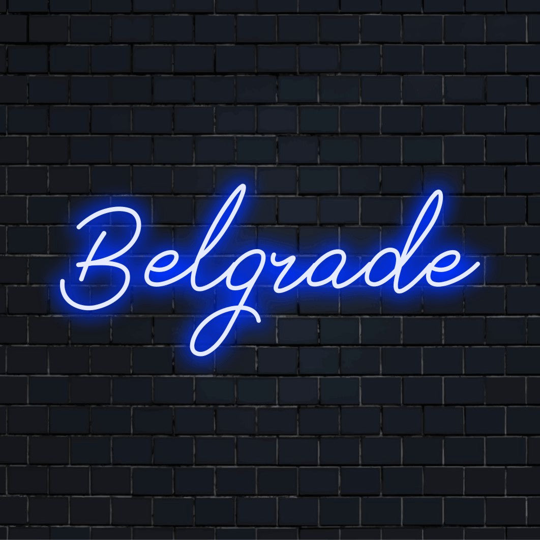 Belgrade Neon Light with bright neon lettering against brick backdrop