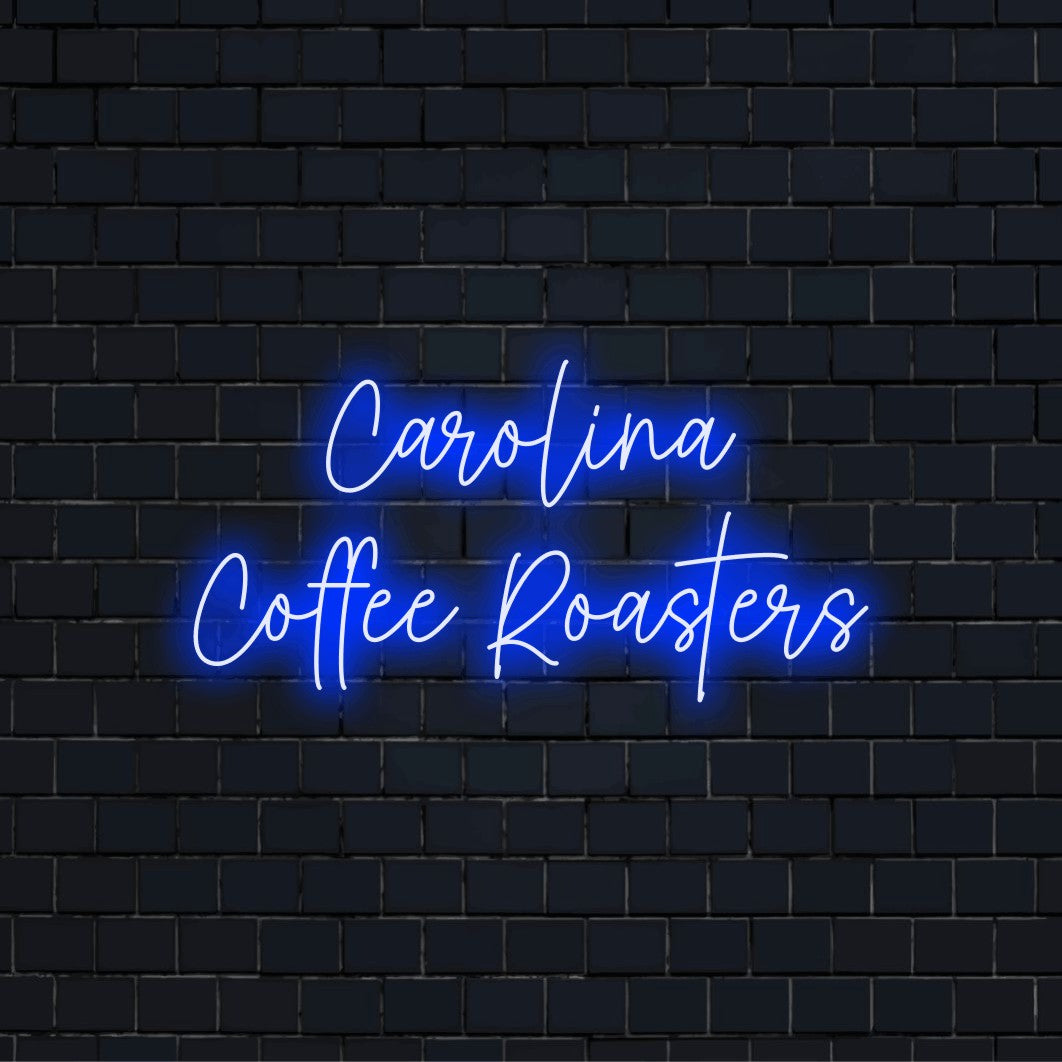 Carolina Coffee Roasters Personalized LED Neon Sign, bright neon lettering on black brick background