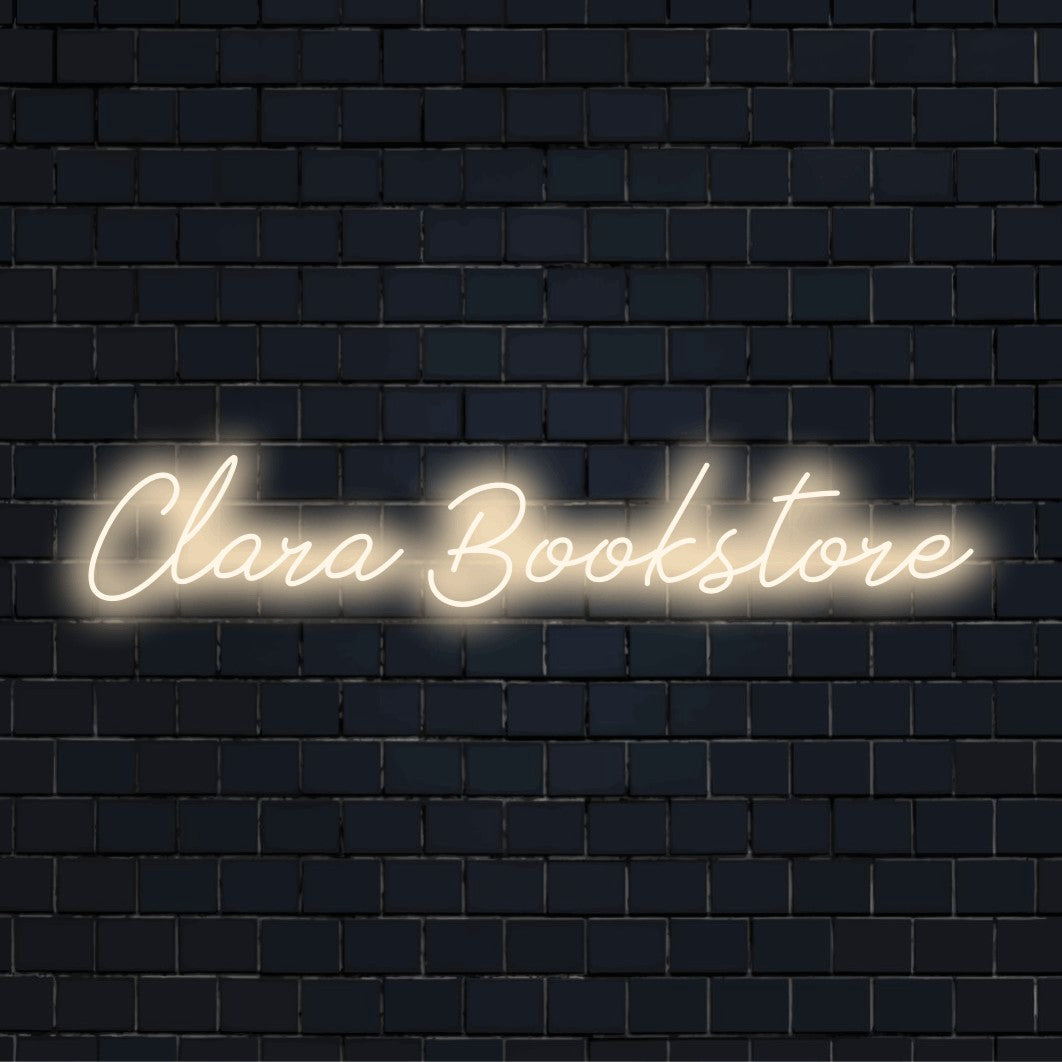 Clara Bookstore Custom Name Neon Sign, glowing wall decor against black brick wall