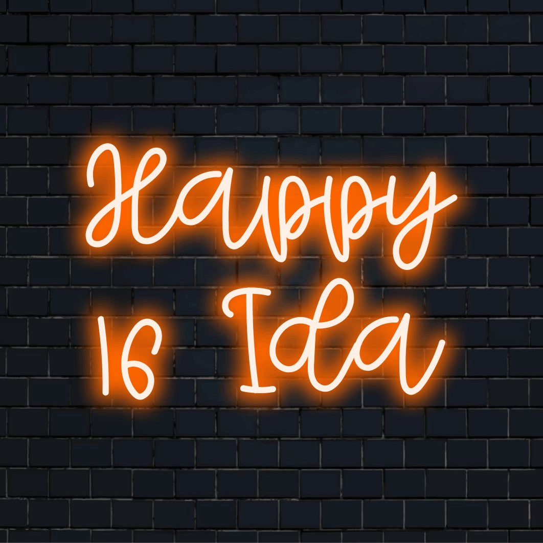 Happy 16 Ida Personalized LED Neon Sign, glowing neon text against black brick wall