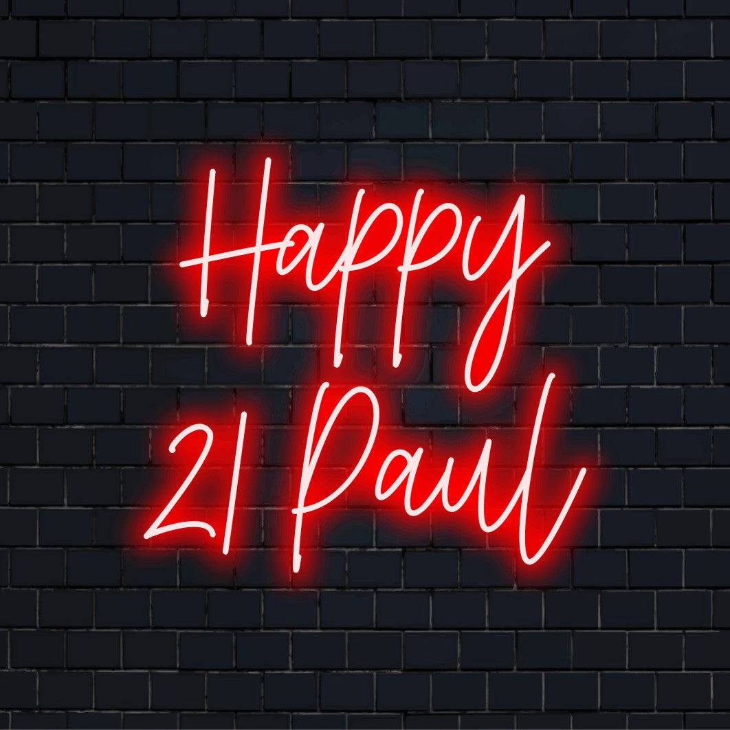 Happy 21 Paul Personalized Neon Light with bright neon glow against brick backdrop