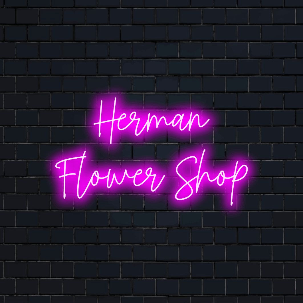 Herman Flower Shop Personalized LED Neon Sign, bright neon glow against brick backdrop