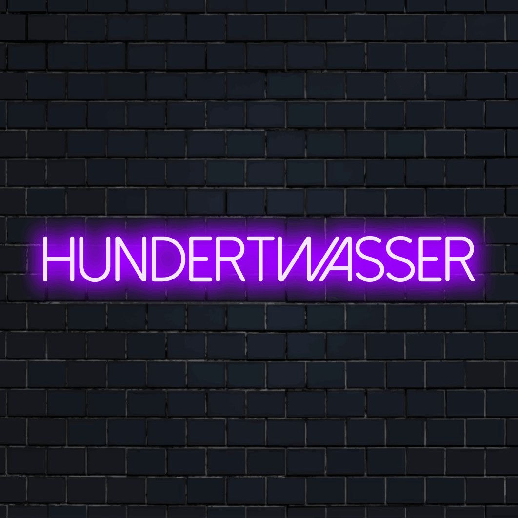 Hundertwasser LED Neon Sign, bright neon lettering on dark brick wall