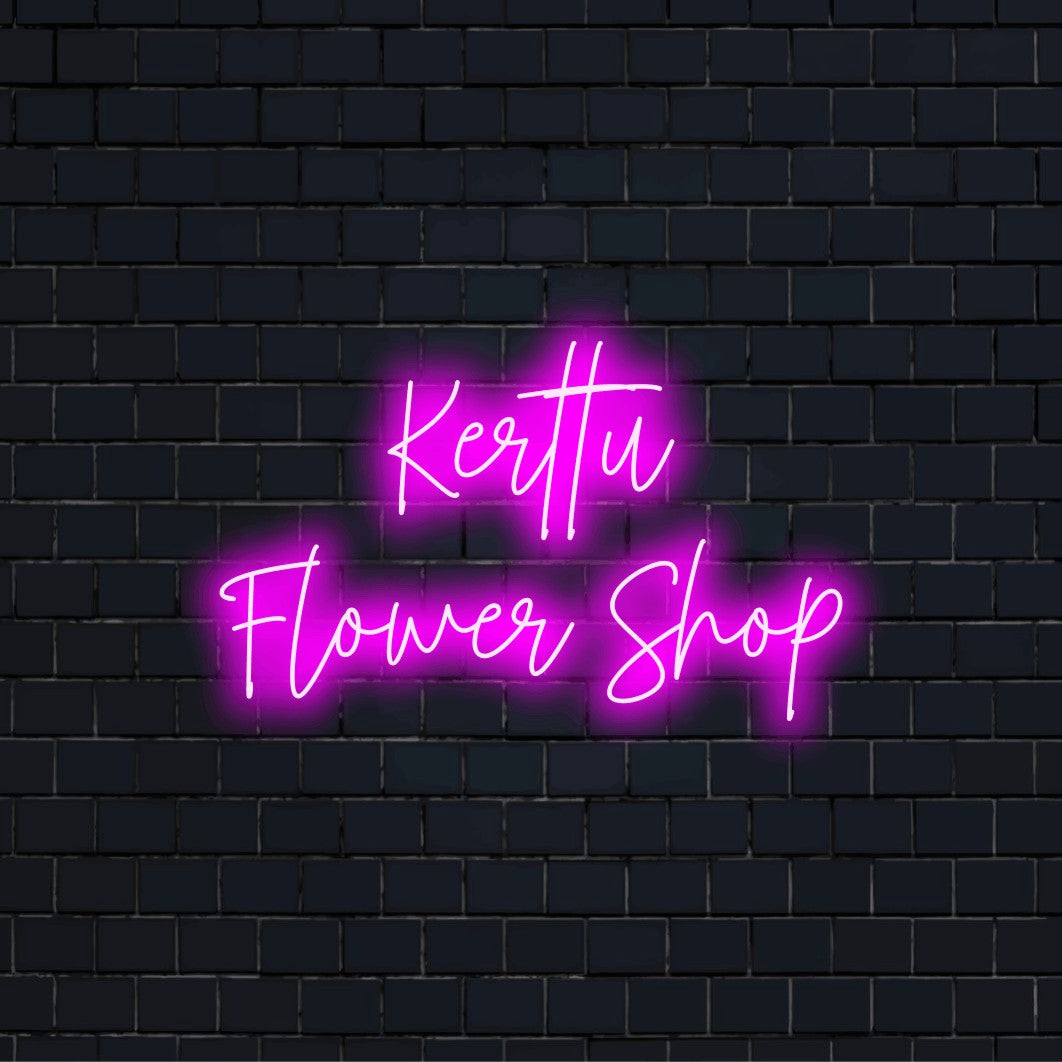 Kerttu Flower Shop Custom Name Neon Sign, bright neon lettering on black brick background
