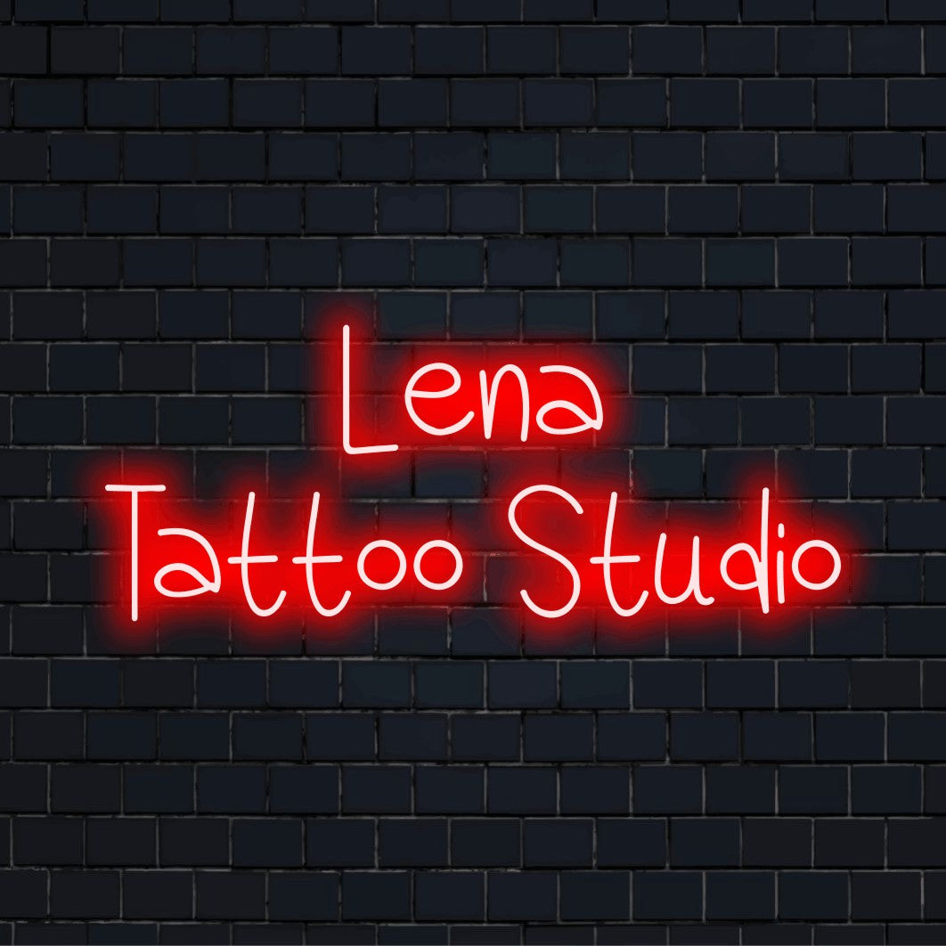 Lena Tattoo Studio Custom Name Neon Sign, bright neon lettering on dark brick wall