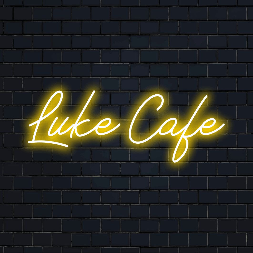 Luke Cafe Personalized Neon Light with bright LED glow on dark brick wall