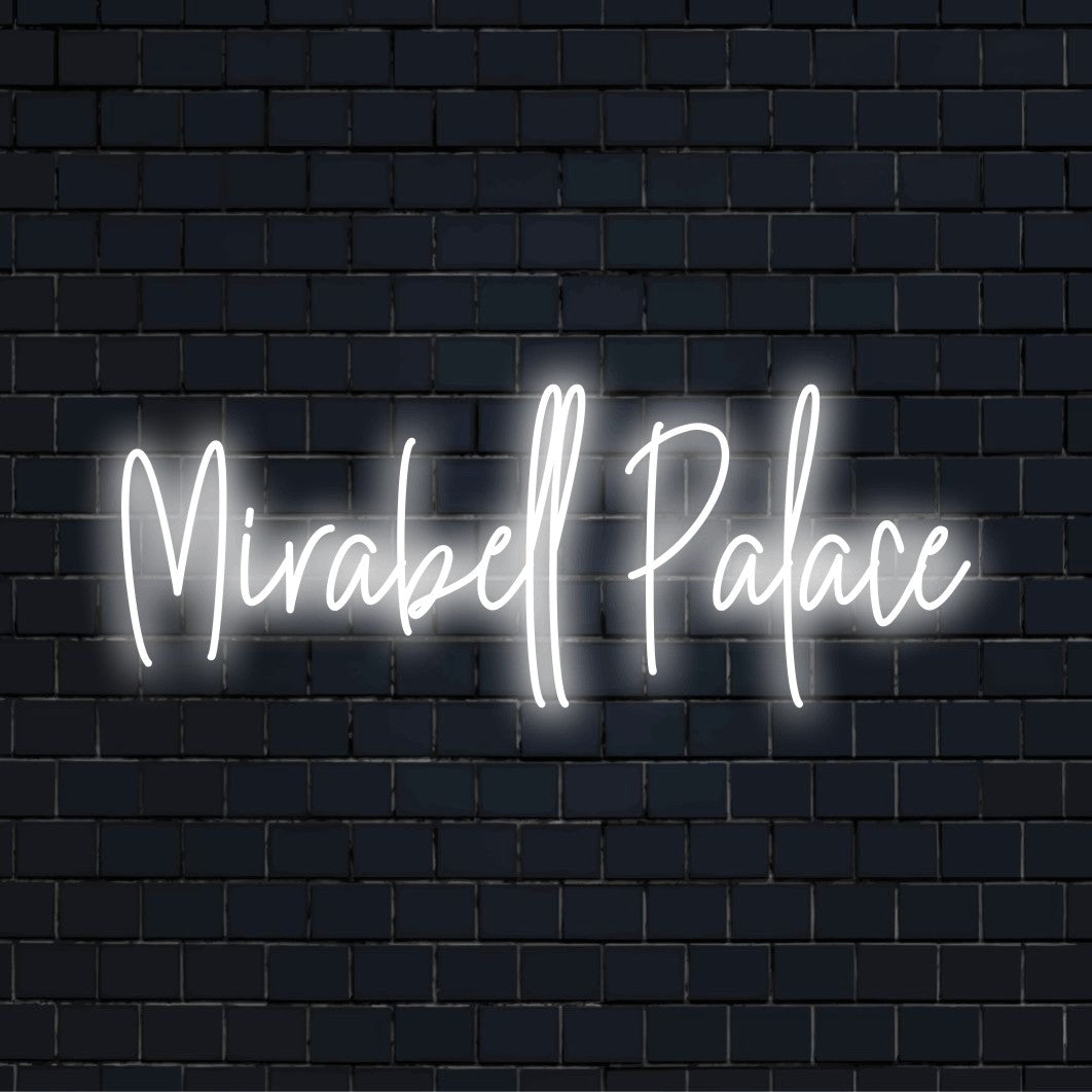 Mirabell Palace Neon Sign, bright neon lettering against black brick wall