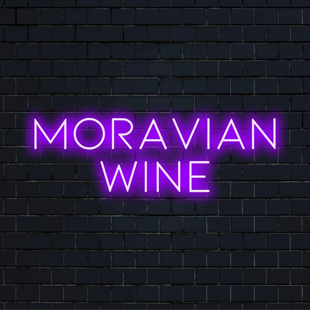 Moravian Wine Neon Light with neon text light against black brick wall
