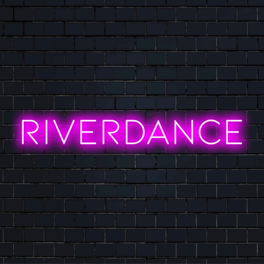 Riverdance Neon Sign, glowing lettering on dark brick background
