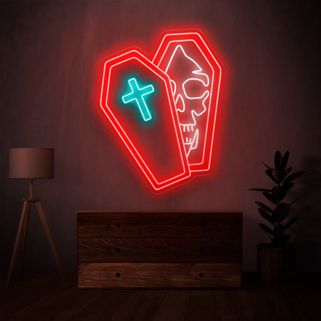 Das Neonschild mit dem Totenkopf im Sarg ist eine makabre Ergänzung zu einer Dekoration mit Gruselthema und strahlt ein unheimliches und fesselndes Licht aus.