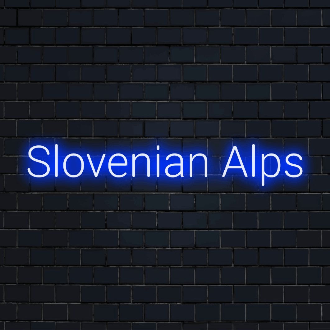 Slovenian Alps LED Neon Sign, glowing lettering against black brick wall
