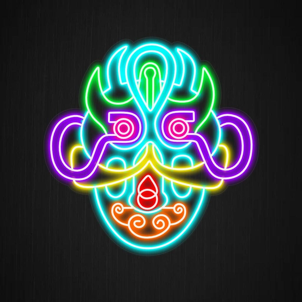 Ein faszinierendes Neonschild mit einem surrealen Maskendesign. Die Neonlichter bilden komplizierte Muster und leuchtende Farben und schaffen so ein optisch beeindruckendes und zum Nachdenken anregendes Schauspiel.