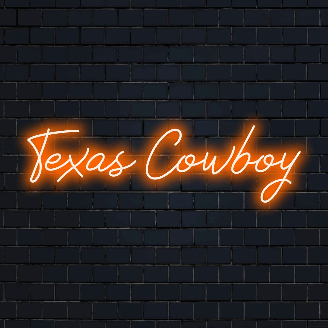 Texas Cowboy Neon Sign, bright neon glow against black brick wall