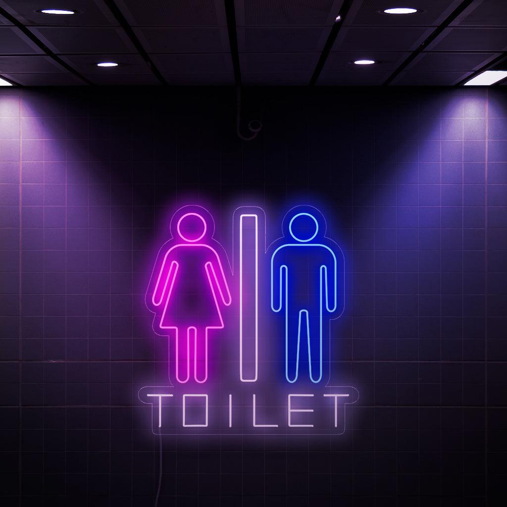 Ein fesselndes Neonschild mit einem Frauen- und einem Männersymbol sowie dem Wort „Toilette“. Dieses einzigartige Schild verleiht Toiletten einen Hauch von Stil und Funktionalität und erleichtert beiden Geschlechtern das Auffinden der Toilette.