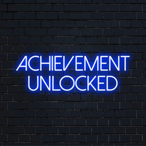 Lebendiges LED-Neonschild mit leuchtendem Text „Achievement Unlocked“, perfekt, um jedem Raum mit modernem Design Energie zu verleihen.