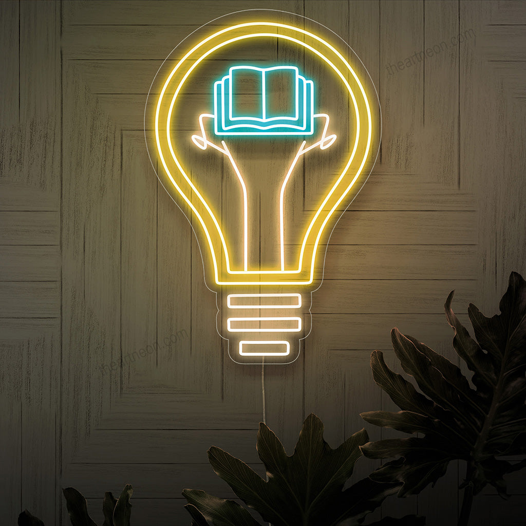 "Book Lightbulb Neon Sign" - An intellectual neon light featuring the combination of a book and a lightbulb, infusing inspiration and a love for literature into your reading nook or library.