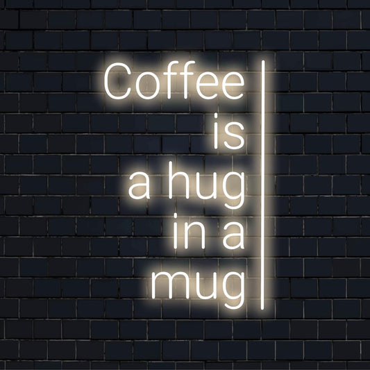 Custom LED sign displaying Coffee Is A Hug In A Mug in bright neon; perfect for cozy decor at home or cafes.
