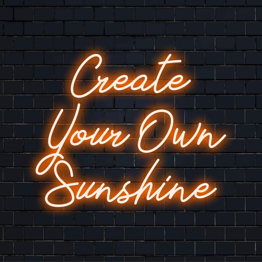 Colorful LED neon sign with the words Create Your Own Sunshine; perfect neon wall art and custom light decor feature.