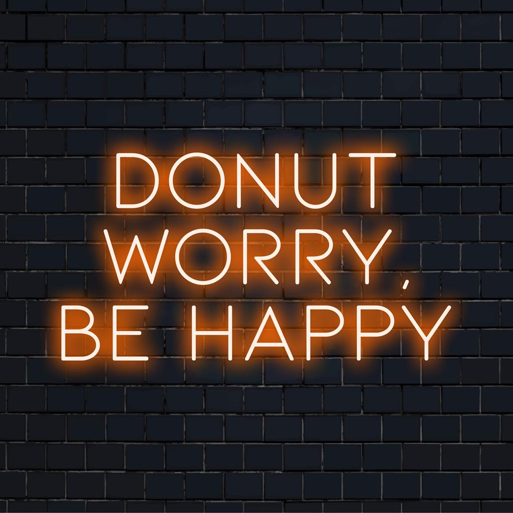 Colorful LED sign with Donnut Worry, Be Happy; blends neon quote art with whimsical light decor. Custom and handmade design.