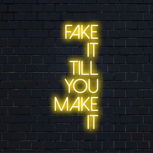 Custom LED neon sign spelling Fake It Till You Make It; stylish neon wall art adding modern glow to any space.