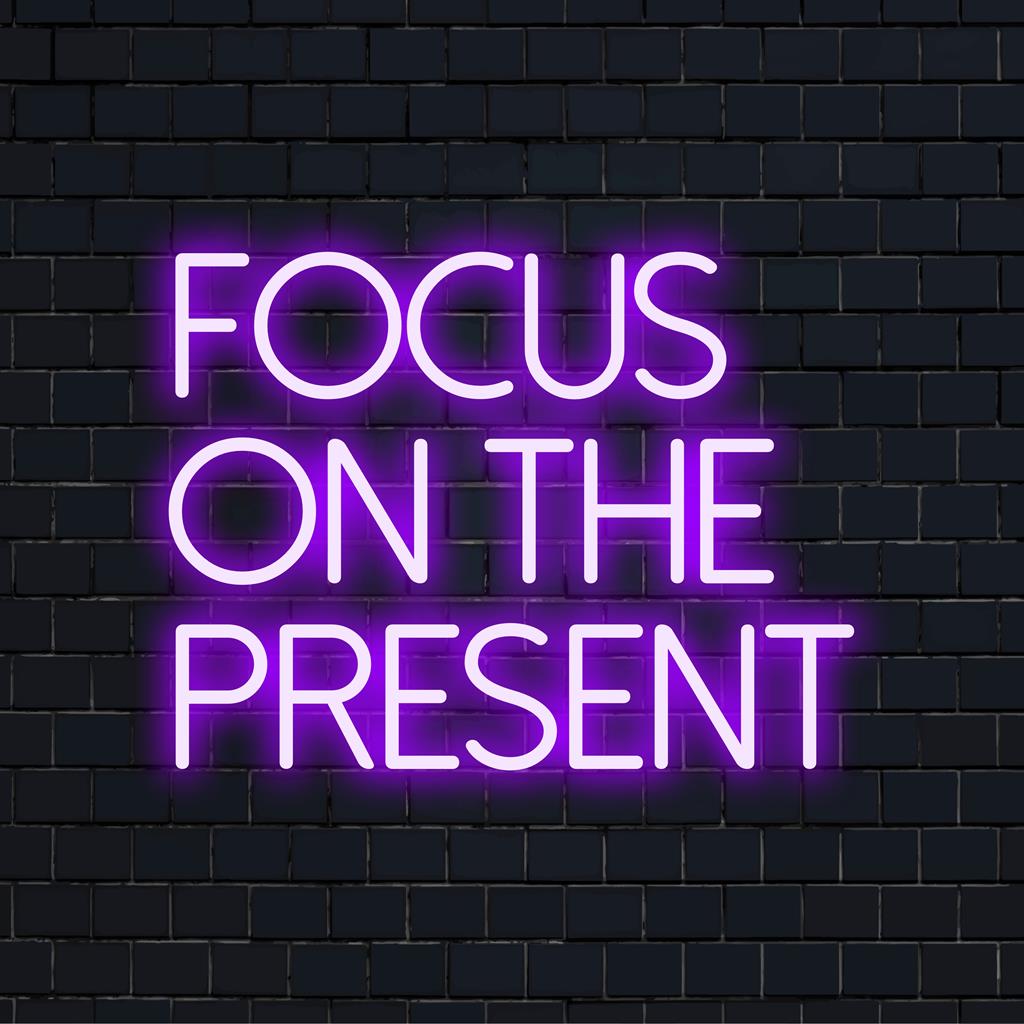 Handcrafted LED neon sign with the message Focus On The Present. Perfect for personalized modern decor and inspiration.
