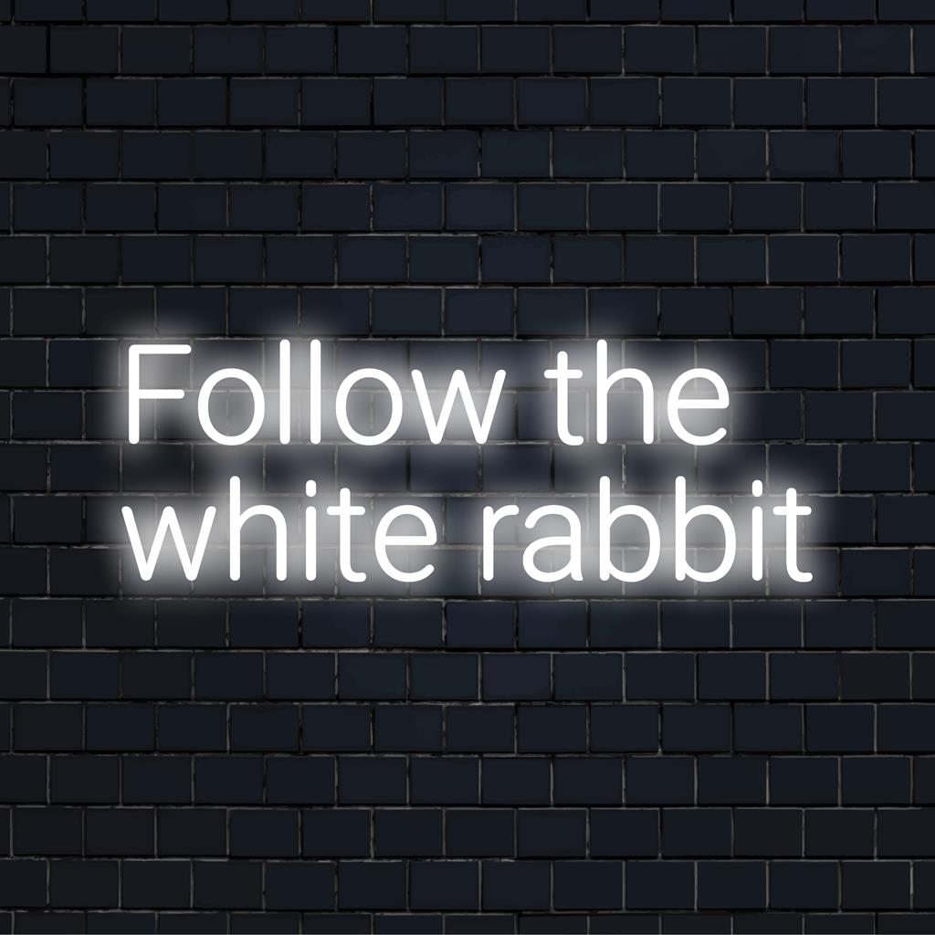 Custom LED neon sign reading Follow The White Rabbit, featuring glowing white letters. Ideal for unique neon wall art.