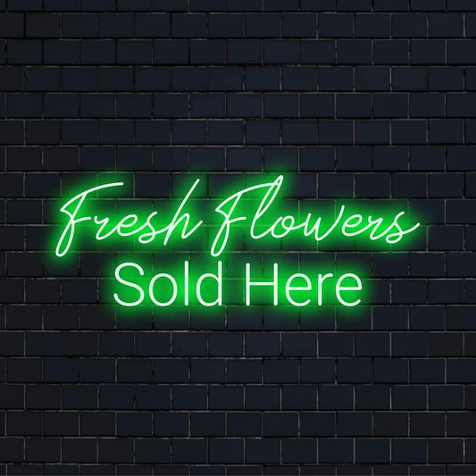 Bright and inviting, this custom made LED neon sign reads Fresh Flowers Sold Here for an eye-catching retail display.