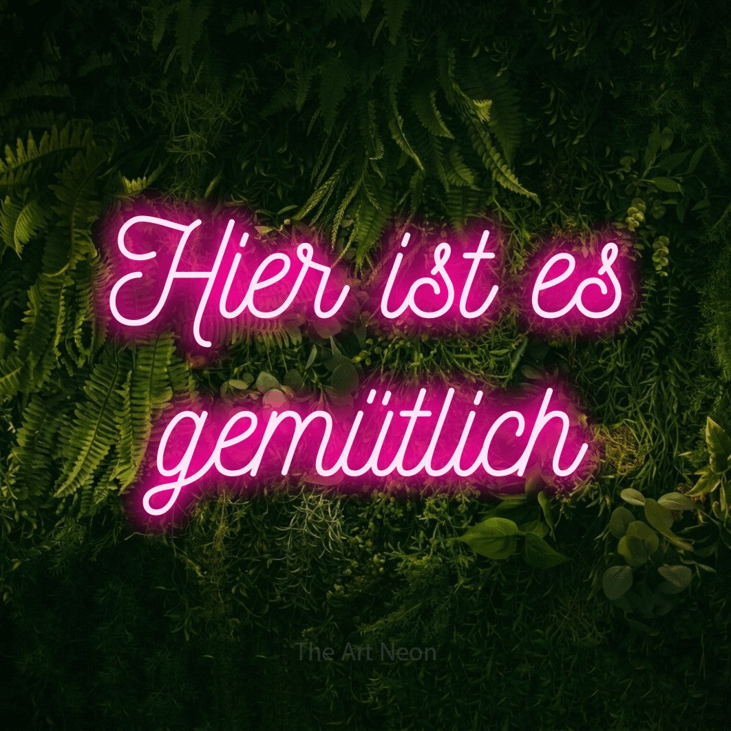 LED neon sign reading “Hier ist es gemütlich”, arranged in 2 lines.
