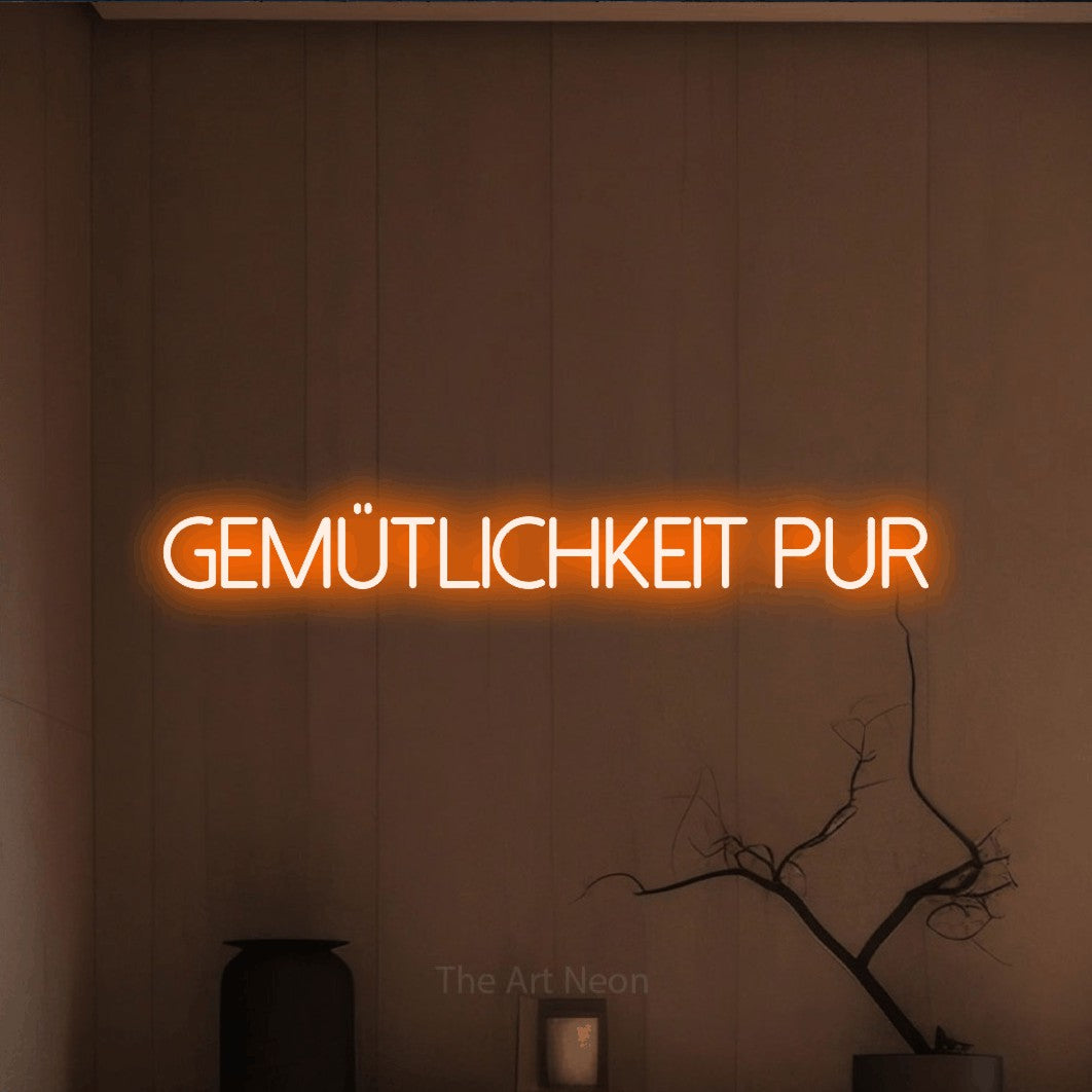LED neon sign reading “Gemütlichkeit pur”, arranged in a single line.